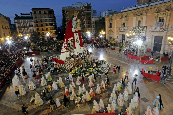 People work on the flower cloak for the Virgen de los Desamparados, the patroness of Valencia, on Monday, March 18.