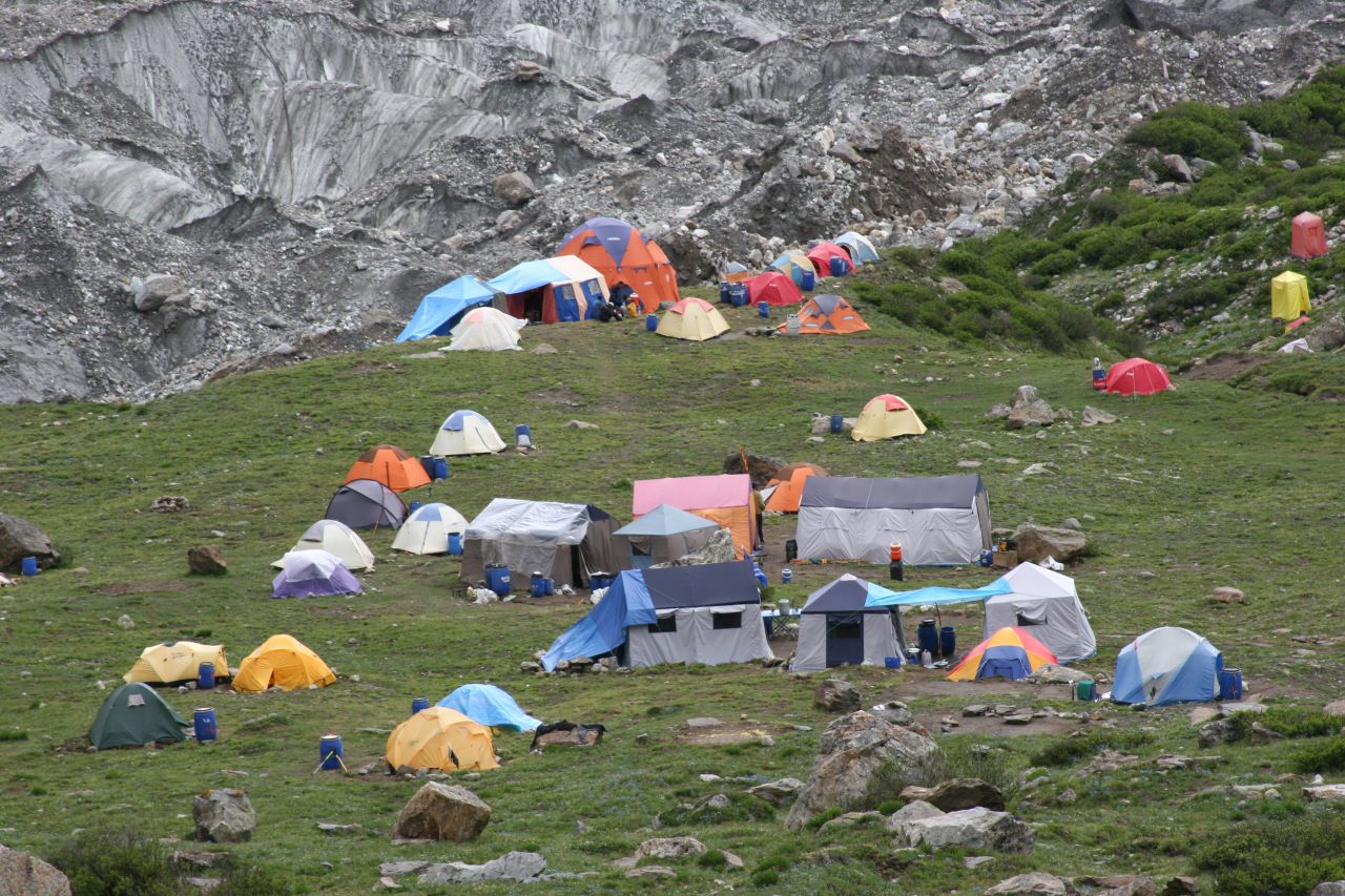 An image of a base camp at Nanga Parbat in 2005 shows the scale of a planned ascent. National Geographic named Pasaban its Adventurer of the Year in 2011 after she completed her challenge.