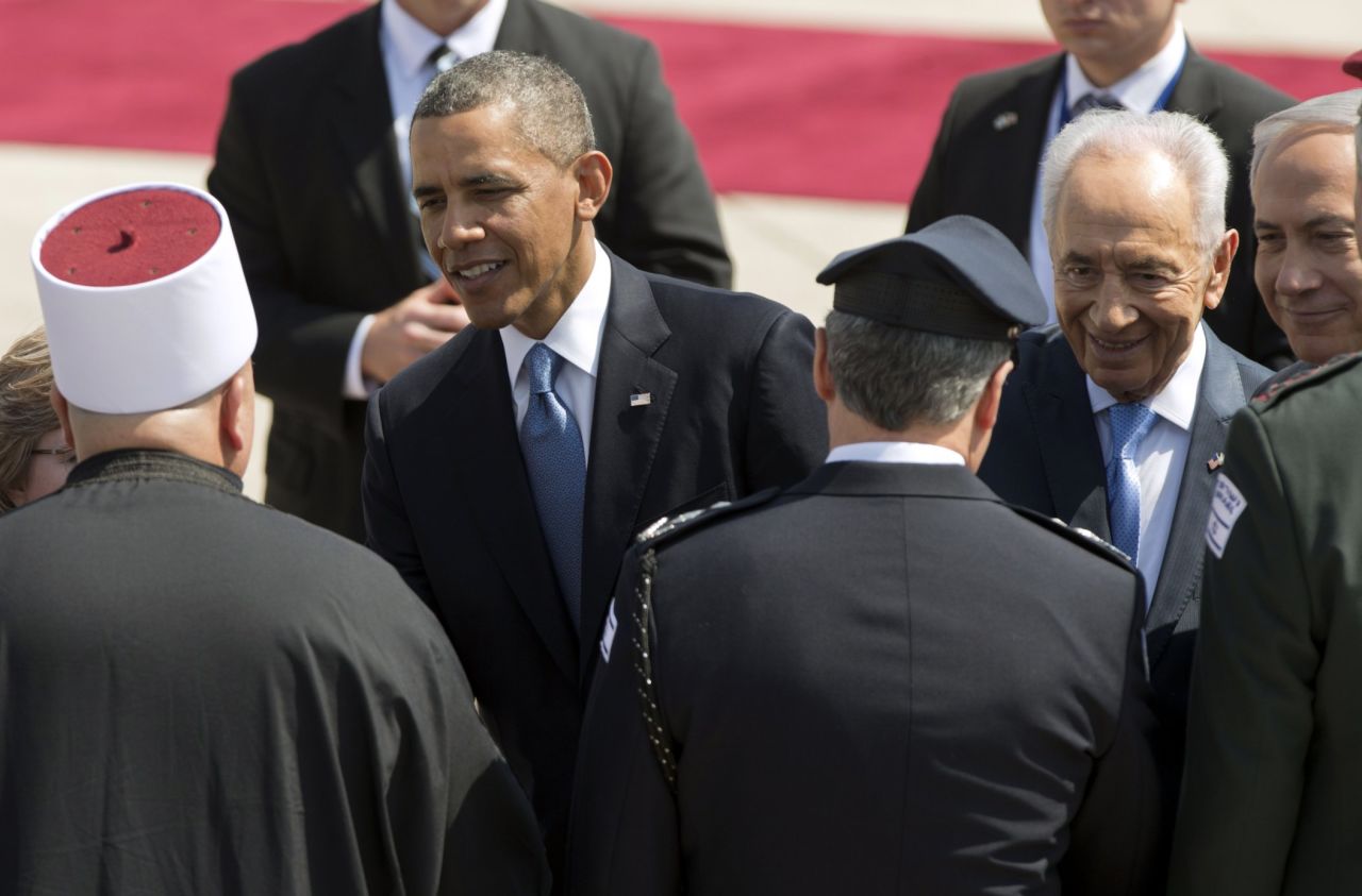 Obama greets Israeli officials during the welcome ceremony at the airport on March 20.  Israeli President Shimon Peres, second from right, and Prime Minister Benjamin Netanyahu, right, are by Obama's side.