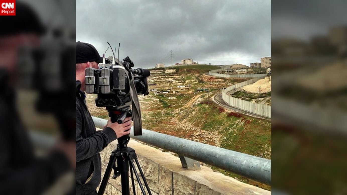 CNN photojournalist Chris Turner shoots video of the Israeli West Bank barrier wall from the Israeli side.  Tensions are increasing on both sides of the wall, including rock attacks on settlers on roads that run between Israeli and Palestinian neighborhoods. 