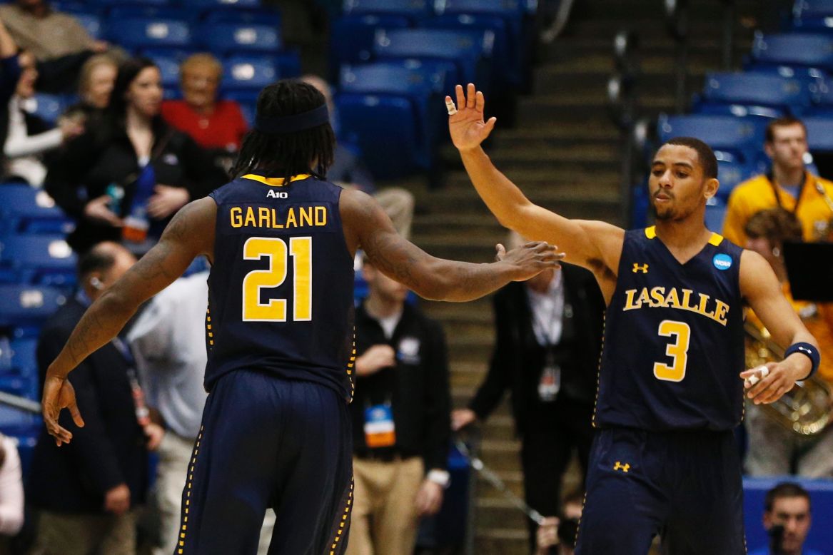 Tyrone Garland and Tyreek Duren of the La Salle Explorers celebrate after defeating the Boise State Broncos 80-71 during the First Four round of the NCAA tournament on Wednesday, March 20, in Dayton, Ohio. Check back to follow the action and see the results as March Madness unfolds.