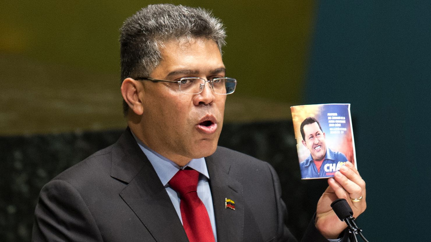 Venezuelan foreign minister Elias Jaua holds a photo of Hugo Chavez during a tribute on March 13 at the U.N. in New York.