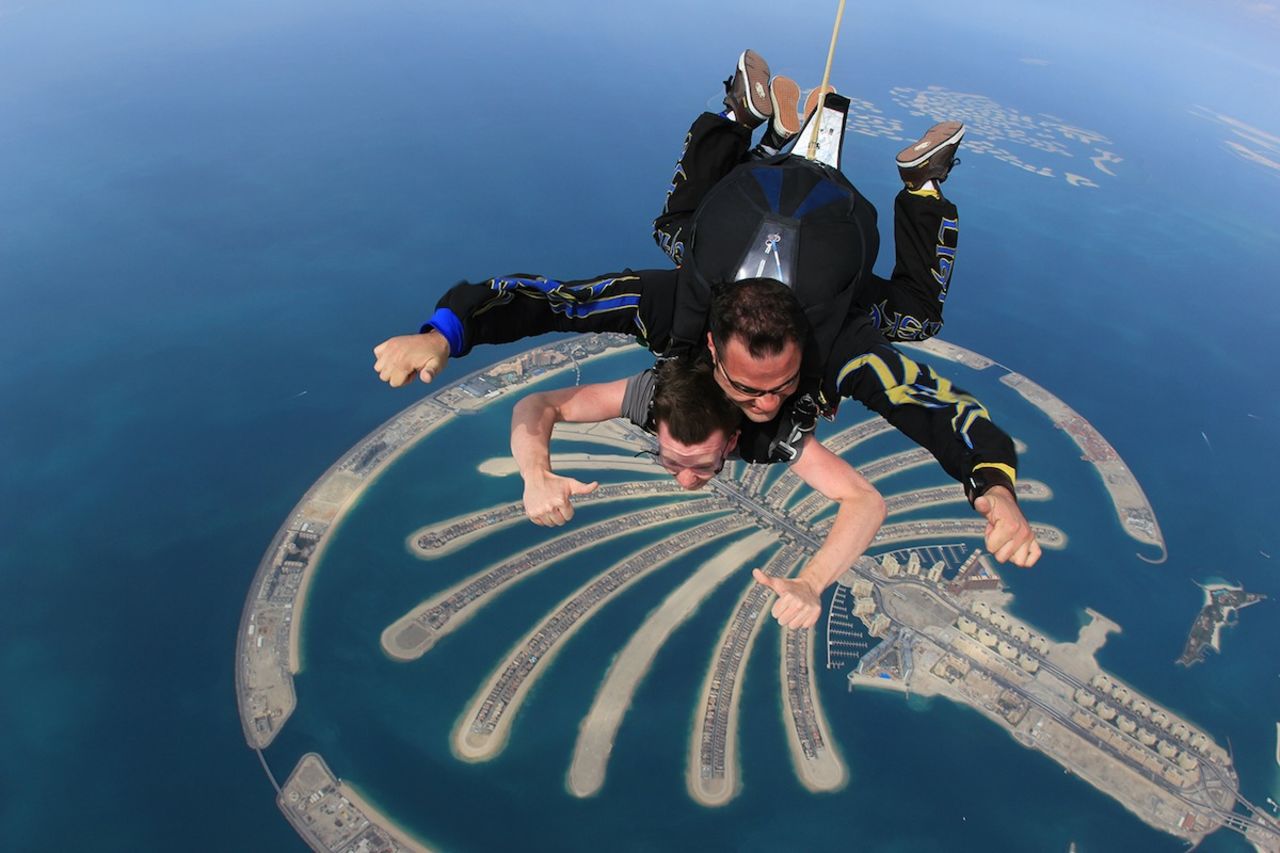 A tandem skydive gives you sweeping views over the city and desert as you plummet almost 4,000 meters (13,000 feet) toward the beach next to the Palm Jumeirah.
