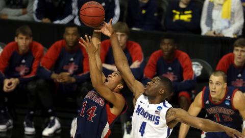 Stephen Holt of St. Mary's attempts to control a rebound against Adonis Thomas of Memphis on March 21.
