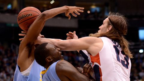 Kelly Olynyk of Gonzaga, right, goes for the ball against Madut Bol and Brandon Moore of Southern University on March 21.