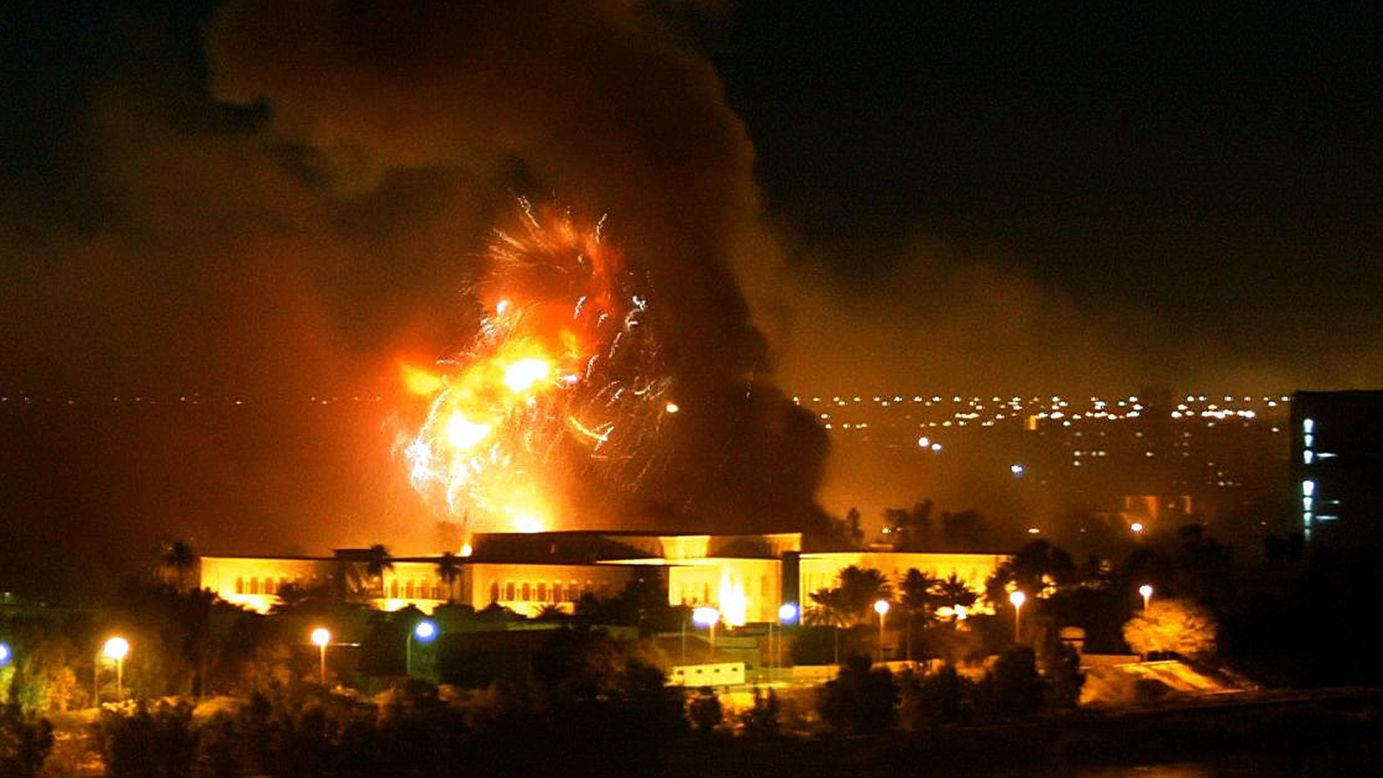 Smoke covers the presidential palace compound during a massive US-led air strike in Baghdad, March 21, 2003. The resolution to go to war with Iraq was passed by the House, 296-133, and the Senate, 77-23.
