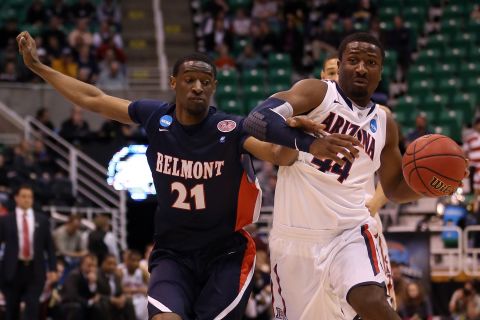 Solomon Hill of the Arizona Wildcats drives on Ian Clark of the Belmont Bruins on March 21.