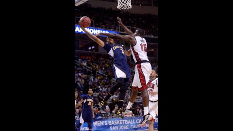 Tyrone Wallace of California drives to the basket against Anthony Bennett of UNLV on March 21.