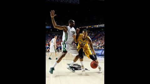 Laurence Bowers of Missouri drives against Greg Smith of Colorado State on March 21.