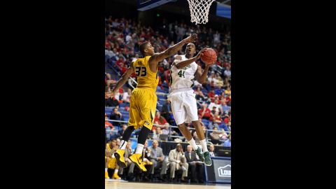 Greg Smith of Colorado State goes up for a shot against Earnest Ross of Missouri on March 21.