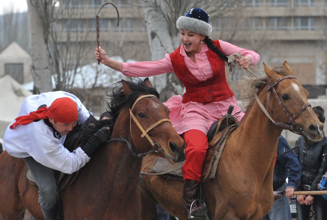 Kyrgyz youth take part in the traditional game 'Kyz Kumay' ('Kiss a girl') during Nowruz celebrations in the Kyrgyzstan's capital Bishkek on March 21, 2013.
