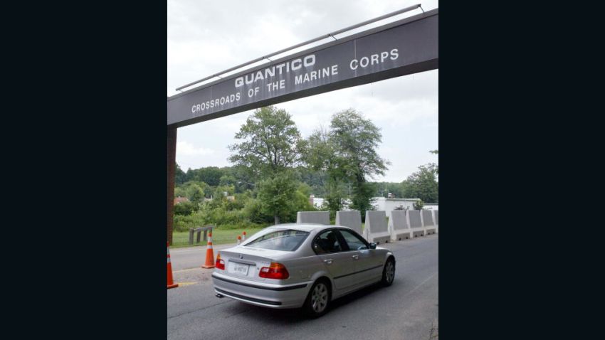 WASHINGTON - JULY 15: Vehicles drive through the main gate at Marine Corps Base Quantico July 15, 2004 in Quantico, Virginia. Cpl. Wassef Ali Hassoun, 24, a Marine who turned up in Lebanon after he was reportedly kidnapped in Iraq is scheduled to return to the Marine Corps Base Quantico today. Hassoun has been at Landstuhl Regional Medical Center in Germany since last week. (Photo by Matthew Cavanaugh/Getty Images)
