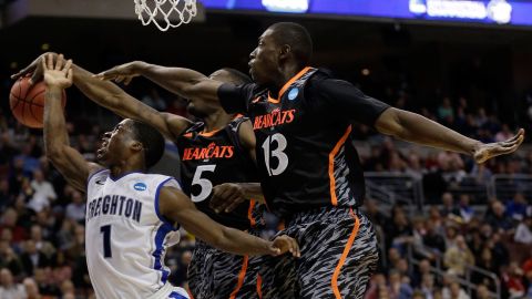 Austin Chatman of the Creighton Bluejays, left, goes up for a shot against Justin Jackson, center, and Cheikh Mbodj of the Cincinnati Bearcats on March 22 in Philadelphia.