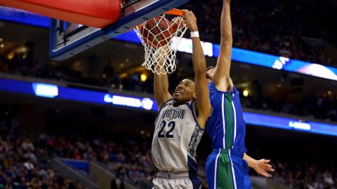 Otto Porter of the Georgetown Hoyas, left, dunks against Chase Fieler of the Florida Gulf Coast Eagles on March 22.