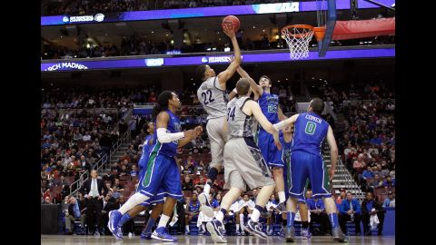 Otto Porter Jr. of the Georgetown Hoyas, center, attempts a shot against Eddie Murray, center right, of the Florida Gulf Coast Eagles on March 22.