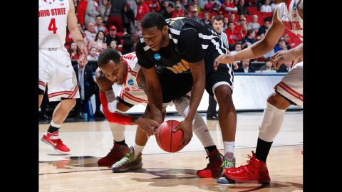 Deshaun Thomas of the Ohio State Buckeyes, left, and David Laury of the Iona Gaels battle for a loose ball on March 22 in Dayton, Ohio.