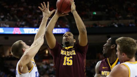 Maurice Walker of the Minnesota Golden Gophers, center, controls the ball against the UCLA Bruins on March 22 in Austin, Texas.