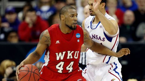 George Fant of the Western Kentucky Hilltoppers, left, drives against Perry Ellis of the Kansas Jayhawks on Friday, March 22, in Kansas City, Missouri. Check back this weekend to follow the action during second round of the 2013 NCAA tournament, and <a href="http://www.cnn.com/2013/03/19/worldsport/gallery/ncaa-tournament-first-round/index.html">look back at the NCAA First Four</a>. 