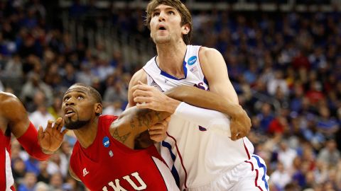 George Fant of the Western Kentucky Hilltoppers, left, boxes out Jeff Withey of the Kansas Jayhawks on March 22.