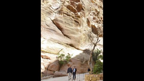 Obama, left, is escorted by Suleiman al-Farajat, a professor of tourism at the University of Jordan, during his visit to a shrine during a tour of the ruins of Petra on March 23.