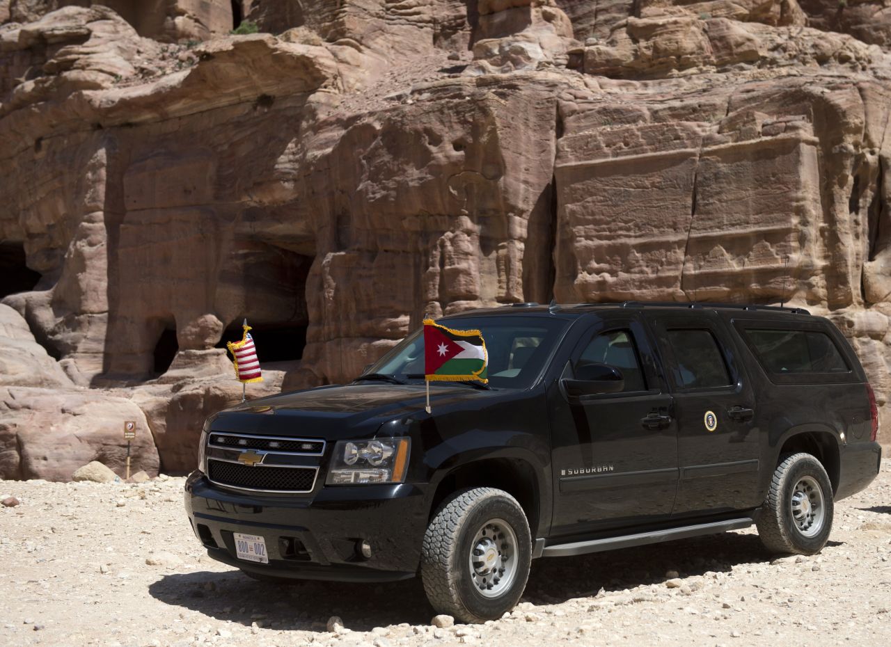 The president's motorcade sits parked on a dirt path as he tours Petra on Saturday.