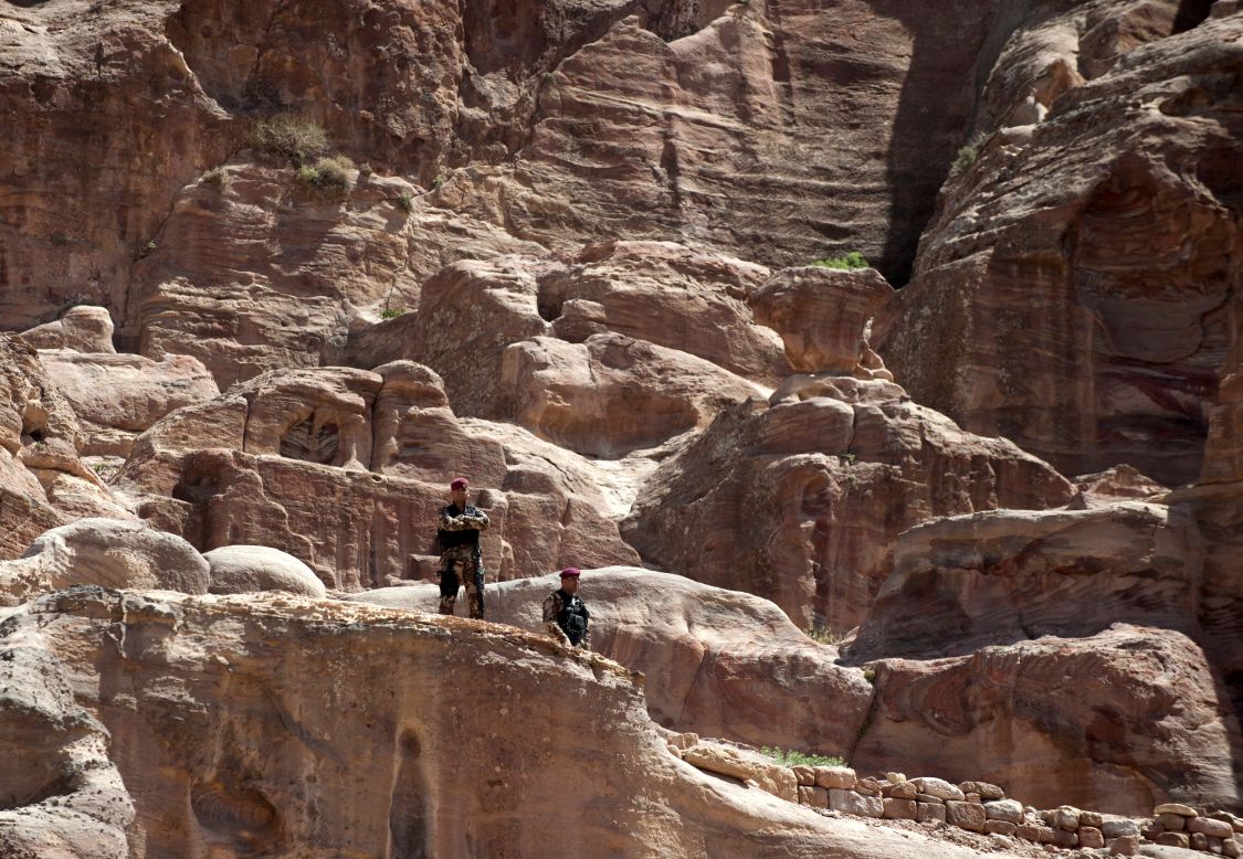 Members of the U.S. Secret Service stand watch in Petra.