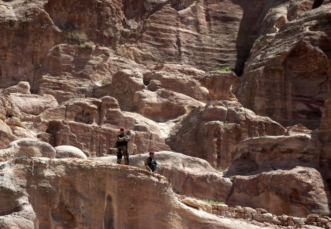 Members of the U.S. Secret Service stand watch in Petra.