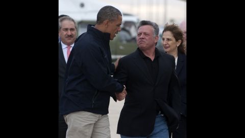 Obama shakes hands with Jordan's King Abdullah II prior to boarding Air Force One to depart from Queen Alia International Airport in Amman, Jordan, on Saturday, March 23.