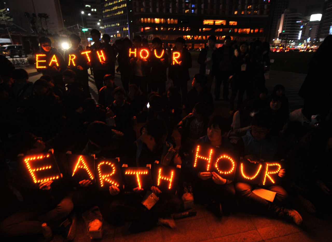 South Korean students hold Earth Hour LED displays during the 7th annual Earth Hour global warming campaign in Seoul on March 23.