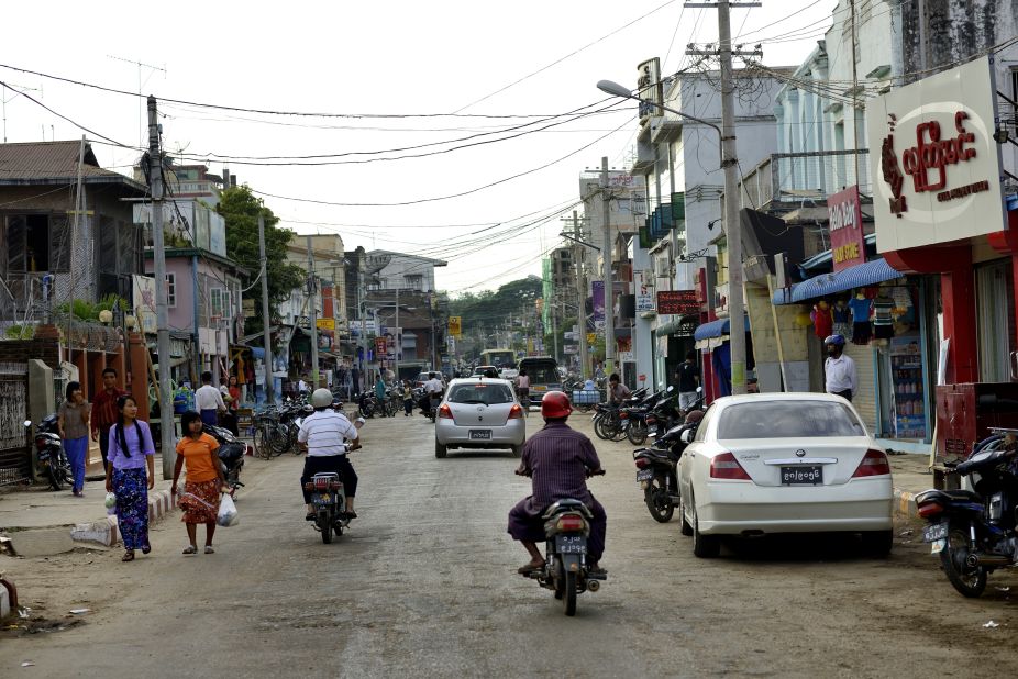 Scooters zip down the road in Pyinmana, a logging town and sugar refinery center near the new capital, Naypyidaw. The capital moved from Yangon to Naypyidaw in 2005.