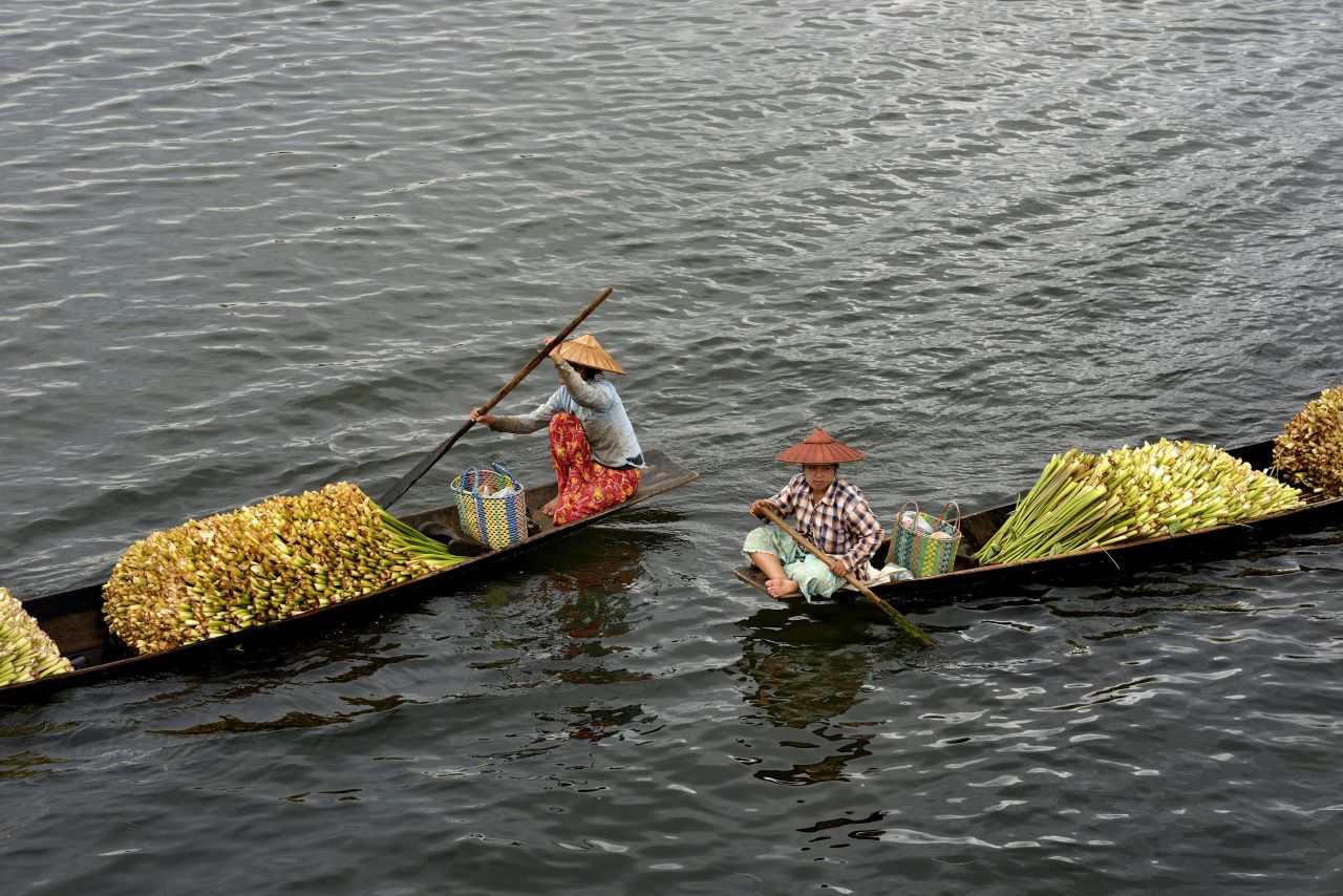 People transport flowers across Inle Lake, a large freshwater lake. 