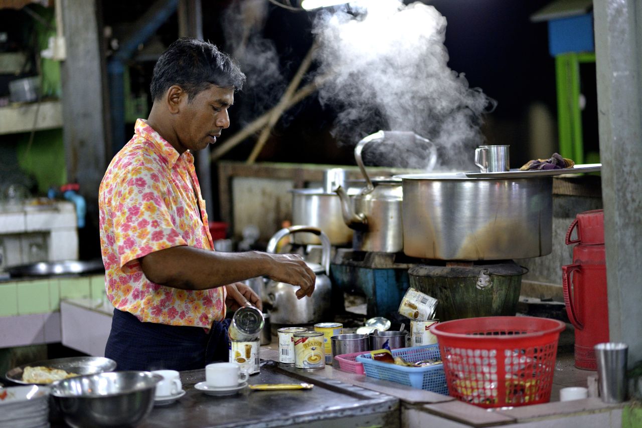 A Burmese man of Indian descent makes tea in a stall in Mawlamyine.