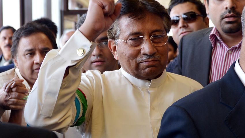 Pakistan's former military ruler Pervez Musharraf gestures upon his arrival at the Karachi International Airport on Sunday. 