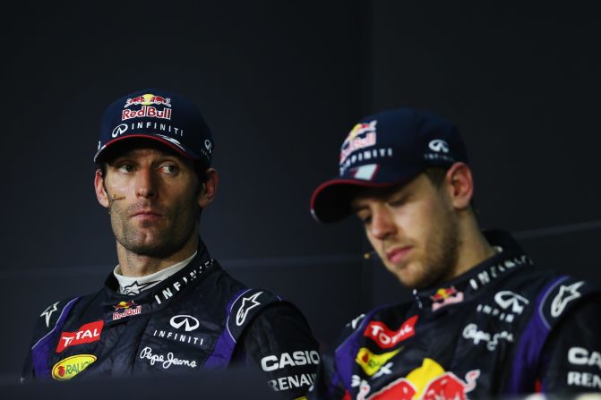 An unhappy Mark Webber, left, with Red Bull teammate Sebastian Vettel at the postrace press conference in Malaysia.
