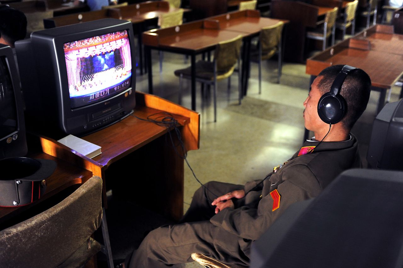 The Study Hall also offers a limited selection of carefully chosen music videos, audio cassettes and CDs. Here a North Korean soldier listens to an opera performance.