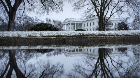 Snow covers the shrubbery around the White House on Monday, March 25.
