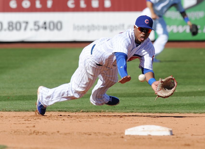 Luis Valbuena of the Chicago Cubs makes a diving catch against the Arizona Diamondbacks during a spring training game on March 1 at Hohokam Stadium in Mesa, Arizona.