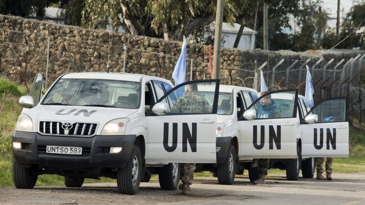 UN peacekeeper vehicles leave the UN headquarters in the demilitarized UNDOF zone in Golan Heights on March 8.