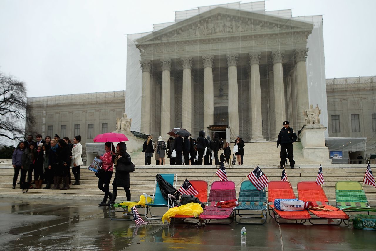 Colorful beach chairs lined up by demonstrators sit in front of the U.S. Supreme Court on Monday, March 25, in Washington.