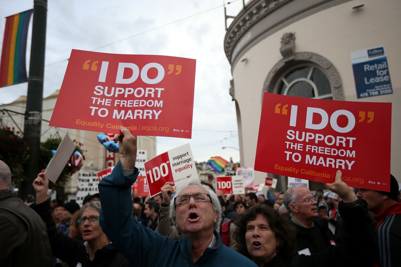 Supporters of same-sex marriage hold signs during a rally in support of marriage equality on March 25 in San Francisco. 
