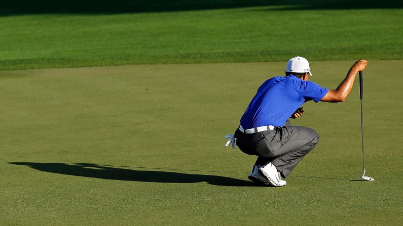 Woods lines up his putt at the Honda Classic in March 2012. <a href="index.php?page=&url=http%3A%2F%2Fedition.cnn.com%2F2012%2F03%2F05%2Fsport%2Fgolf%2Fgolf-mcilroy-augusta-woods">He shot a 62, his lowest final round as a professional</a>, but he tied for second in the PGA Tour event.