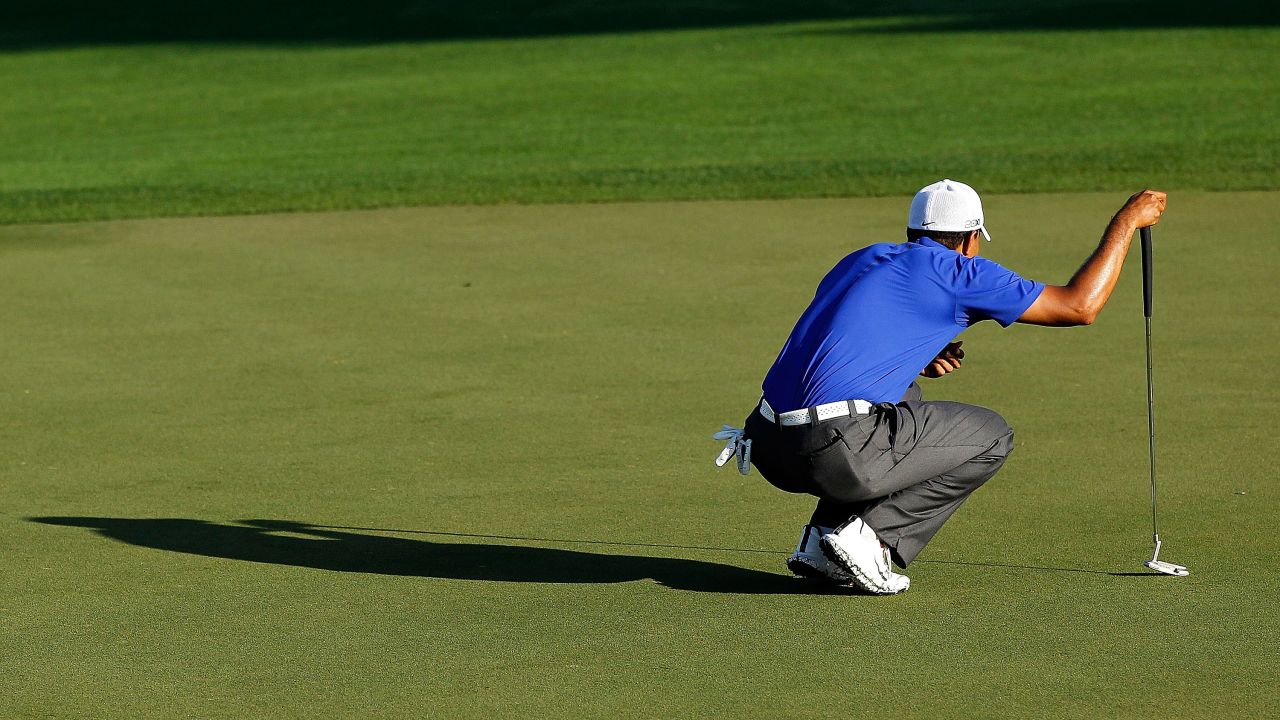 Woods lines up his putt at the Honda Classic in March 2012. <a href="http://edition.cnn.com/2012/03/05/sport/golf/golf-mcilroy-augusta-woods">He shot a 62, his lowest final round as a professional</a>, but he tied for second in the PGA Tour event.