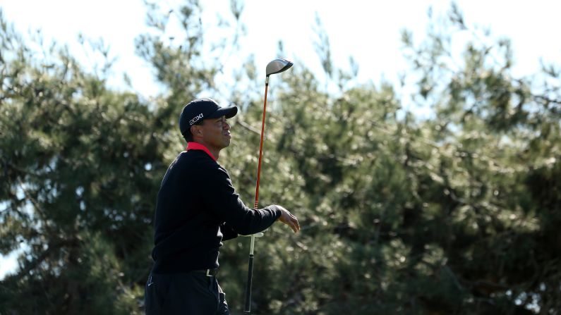 Woods hits his tee shot on the 12th hole during the final round of the Farmers Insurance Open at Torrey Pines in January 2013. <a href="index.php?page=&url=http%3A%2F%2Fmoney.cnn.com%2F2012%2F07%2F17%2Fnews%2Feconomy%2Ftiger-woods-pay%2Findex.htm">He lost his title the previous year as the world's top-paid athlete</a>, dropping to third place on <a href="index.php?page=&url=http%3A%2F%2Fsportsillustrated.cnn.com%2Fspecials%2Ffortunate50-2012%2Findex.html">Sports Illustrated's "Fortunate 50" list</a>.