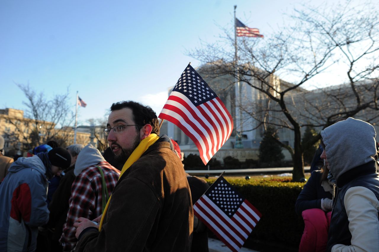 People line up in front of the Supreme Court on Tuesday. 