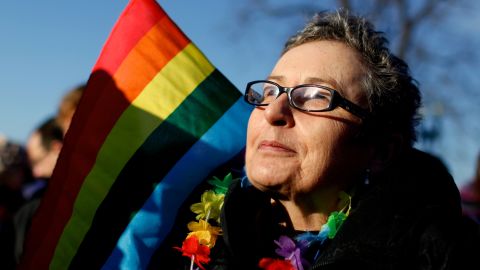 Gail Schulte, of Alexandria, Virginia, gathers with other demonstrators Tuesday.