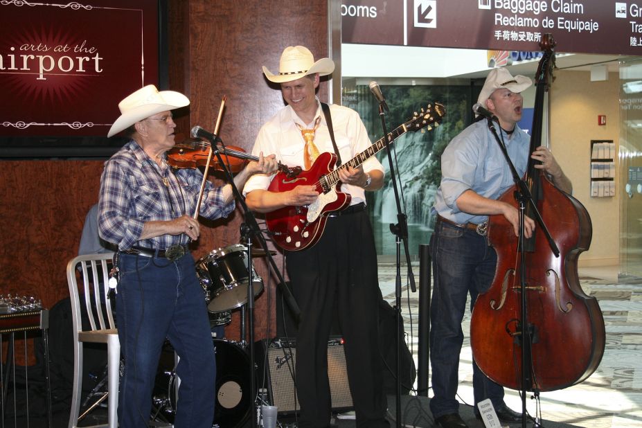 The Western Swingers band perform for travelers at Nashville International Airport. Playing on the city's rich musical heritage, the facility hosts upwards of 100 concerts every year. 