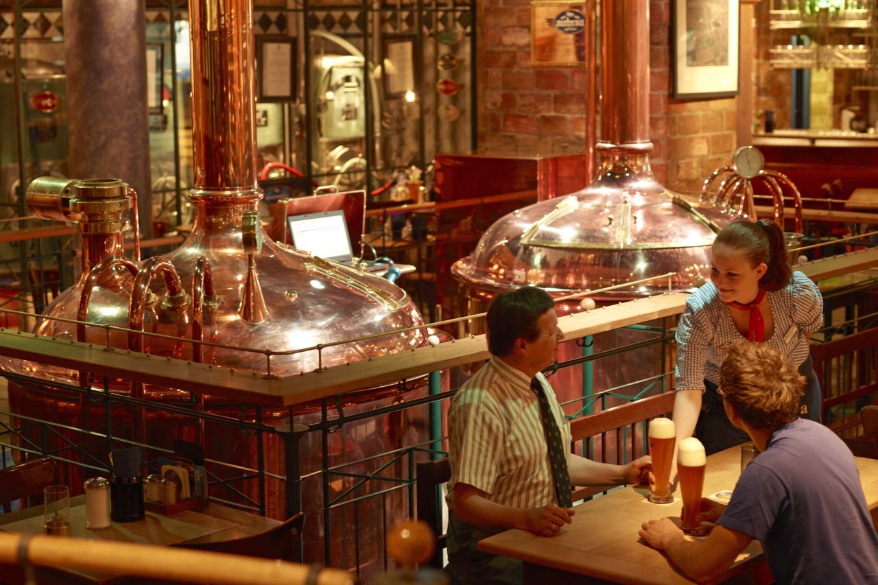 Thirsty passengers prepare to sample the home-brewed beer at Airbrau, Munich Airport's traditional German tavern. The Bavarian-themed bar also hosts a beer garden and regular cabaret performances.