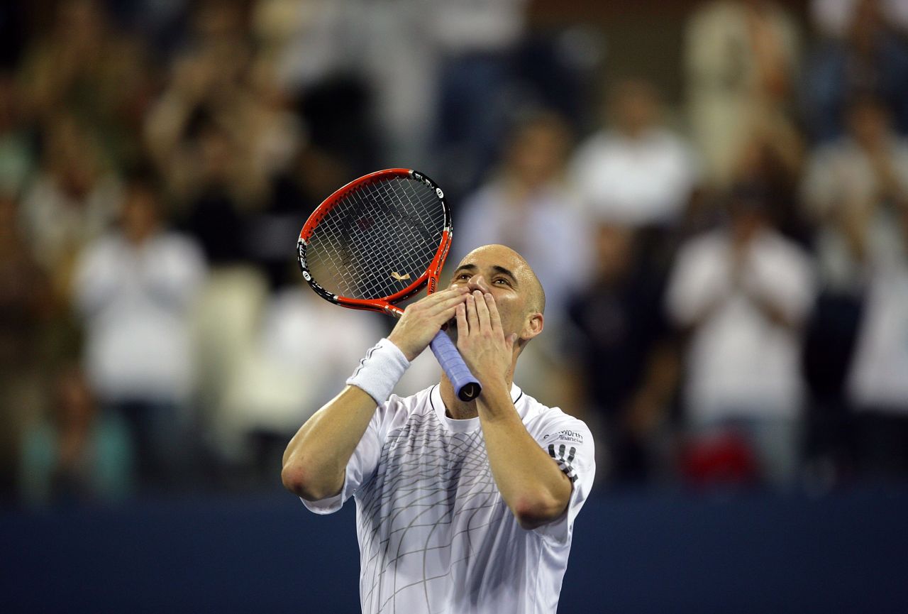 Agassi blows kisses to the crowd after winning his first round match at the 2006 U.S. Open. But he would retire from the sport at the age of 36 after losing to Germany's Benjamin Becker in the third round.
