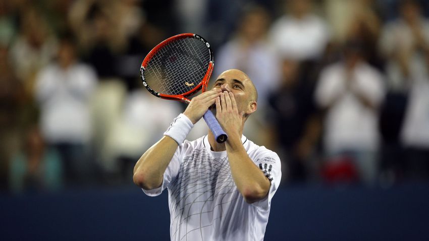 Andre Agassi blows kisses to the crowd winning his first round at the 2006 U.S. Open. He would retire from the sport after losing to Germany's Benjamin Becker in the third round. (Photo: Matthew Stockman/Getty Images)