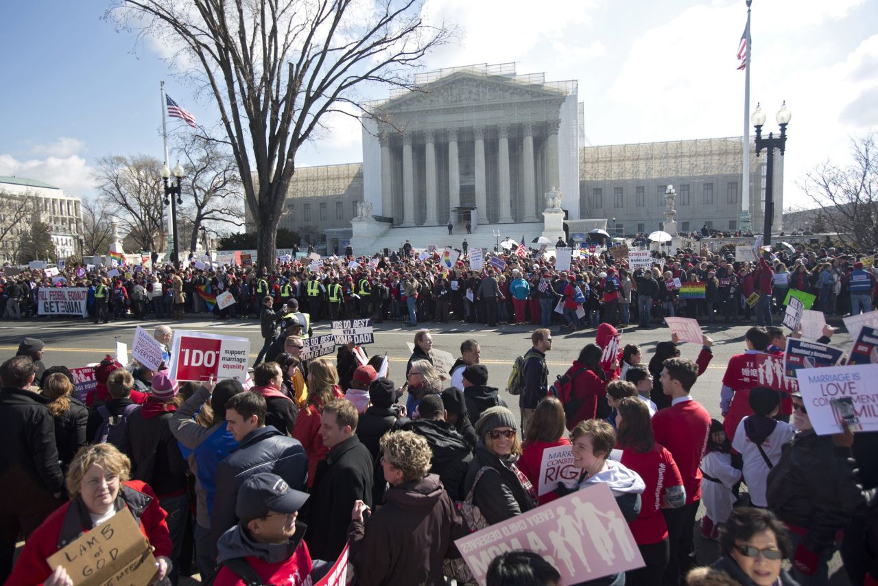 Crowds gather outside the Supreme Court on Tuesday as justices hear the first case on same-sex marriage.